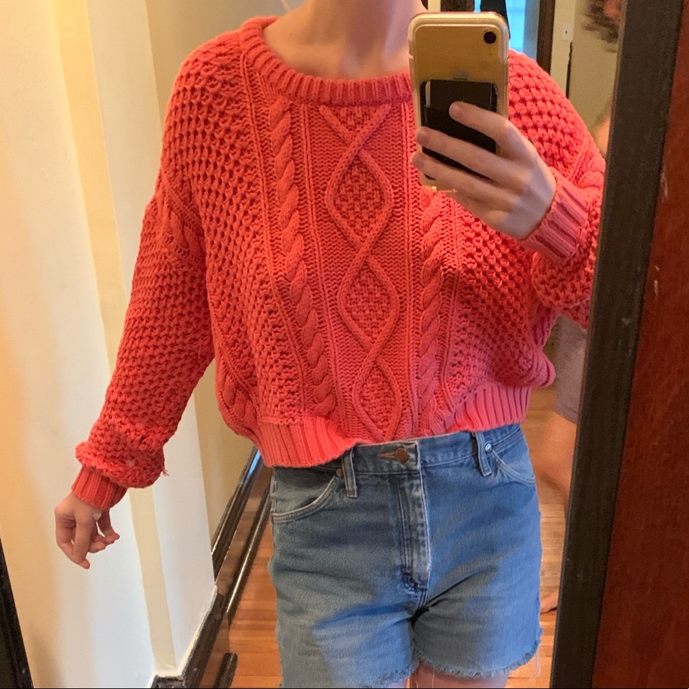 BDG cable-knit pink cropped sweater.